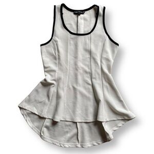 White & black peplum fit flair high low tank top